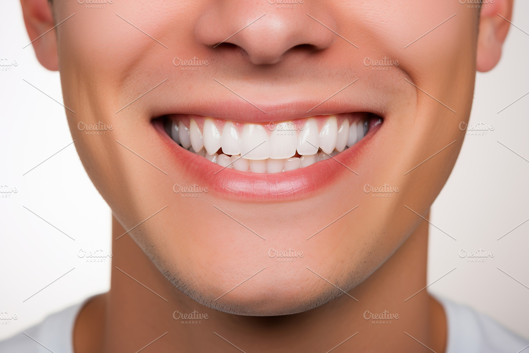 Young man showing healthy teeth, a Beauty & Fashion Photo by AlyaAnd