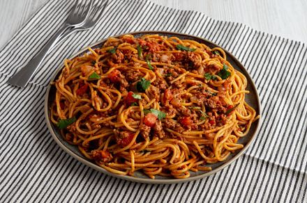 Homemade One-Pot Taco Spaghetti on a Plate, side view., a Food & Drink Photo by LiudmylaChuhunova
