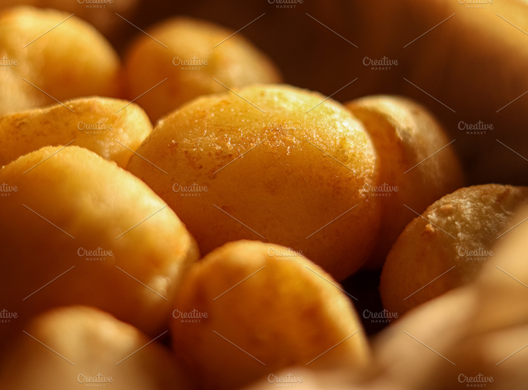 Golden fried patatas bravas or accras close up, warm potato or vegetable fritte, a Photo by Studio ANNA