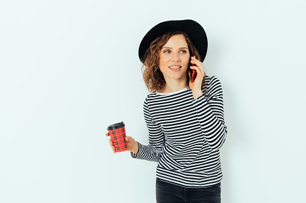 Stylish young woman wearing black fedora hat and striped shirt, a Person Photo by progressman
