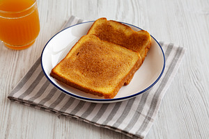Homemade American Cinnamon Toast with Butter and Orange Juice, s, a Food & Drink Photo by LiudmylaChuhunova