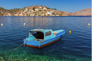Small Boat in Harbor of Symi, Greece, a Nature Photo by kavalenkava