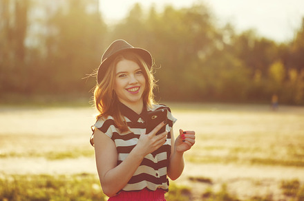 Lovely girl in hat holding phone, a Person Photo by Elena Vagengeim