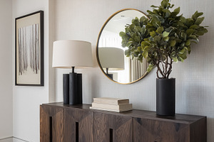 Modern living room or hallway console table decorated with a lam, a Photo by Studio ANNA