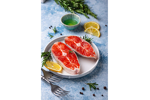 Raw uncooked salmon with rosemary, a Food & Drink Photo by Yulia Furman