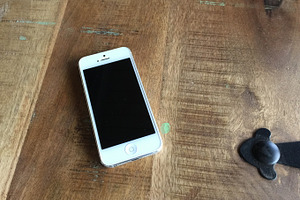iPhone 5 on wood table