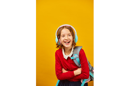 Happy schoolgirl with backpack, a Person Photo by IlliaBondarPhotography