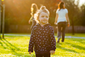 Little baby girl plays in the park stock photo containing people and portrait