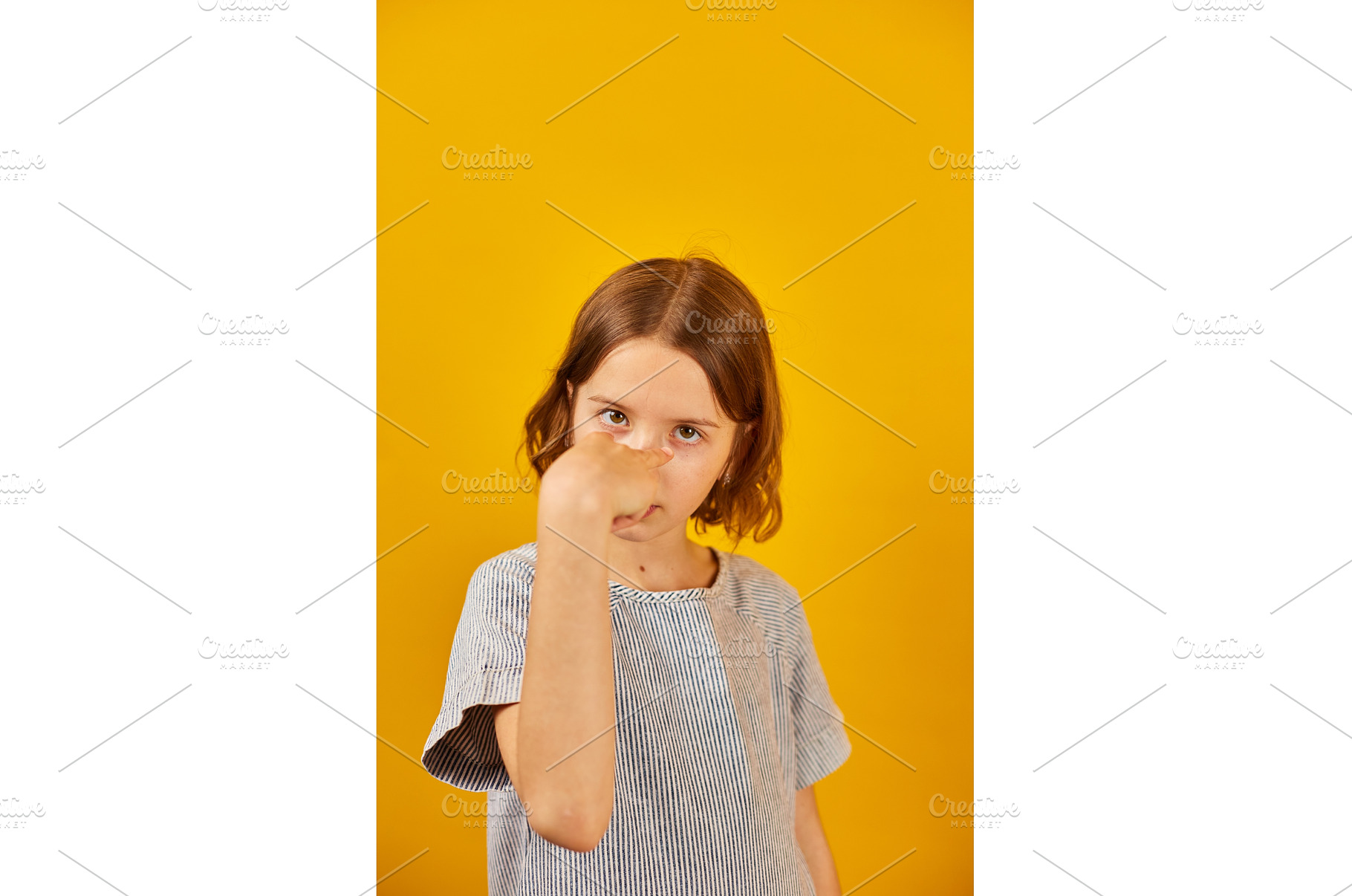 Child making a finger-pointing, a Background Photo by IlliaBondarPhotography