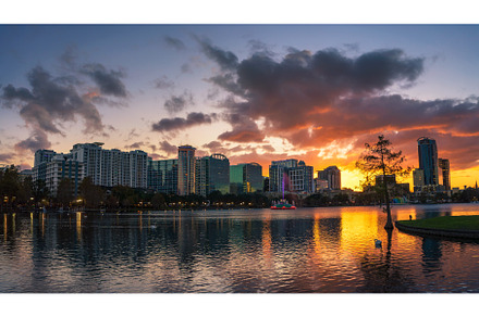 Colorful sunset above Lake Eola and, an Architecture Photo by Nick Fox