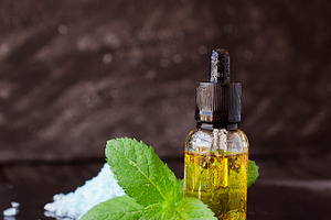 Jar of menthol oil selective focus space for text featuring essential, oil