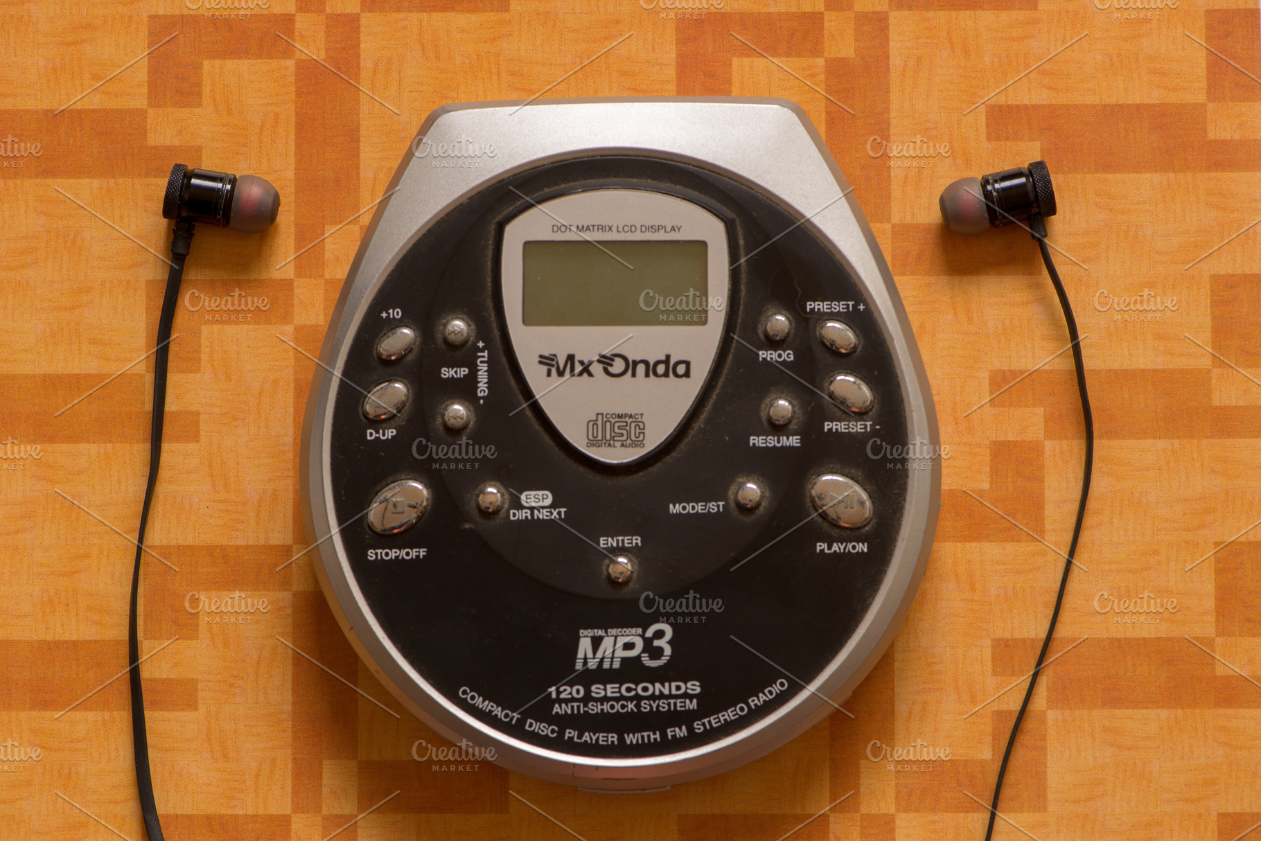 A CD player, a Background Photo by Vicente Soler