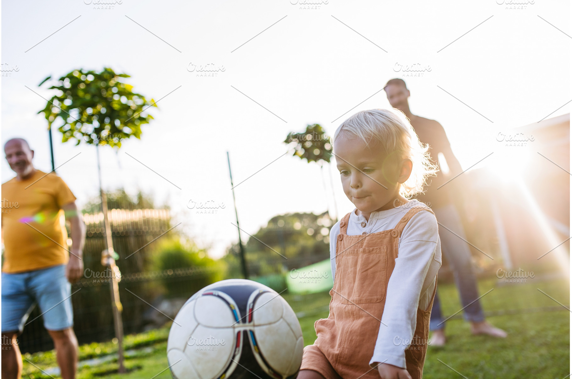Little boy playing football with, a Sports & Recreation Photo by HalfPoint