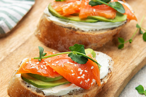Smoked salmon toast with avocado and cream cheese, a Food & Drink Photo by Olena Rudo