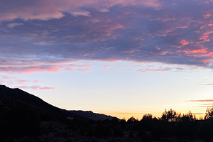 Sunset over Utah desert hills with purple clouds and silhouettes at dusk, a Nature Photo by AS photostudio