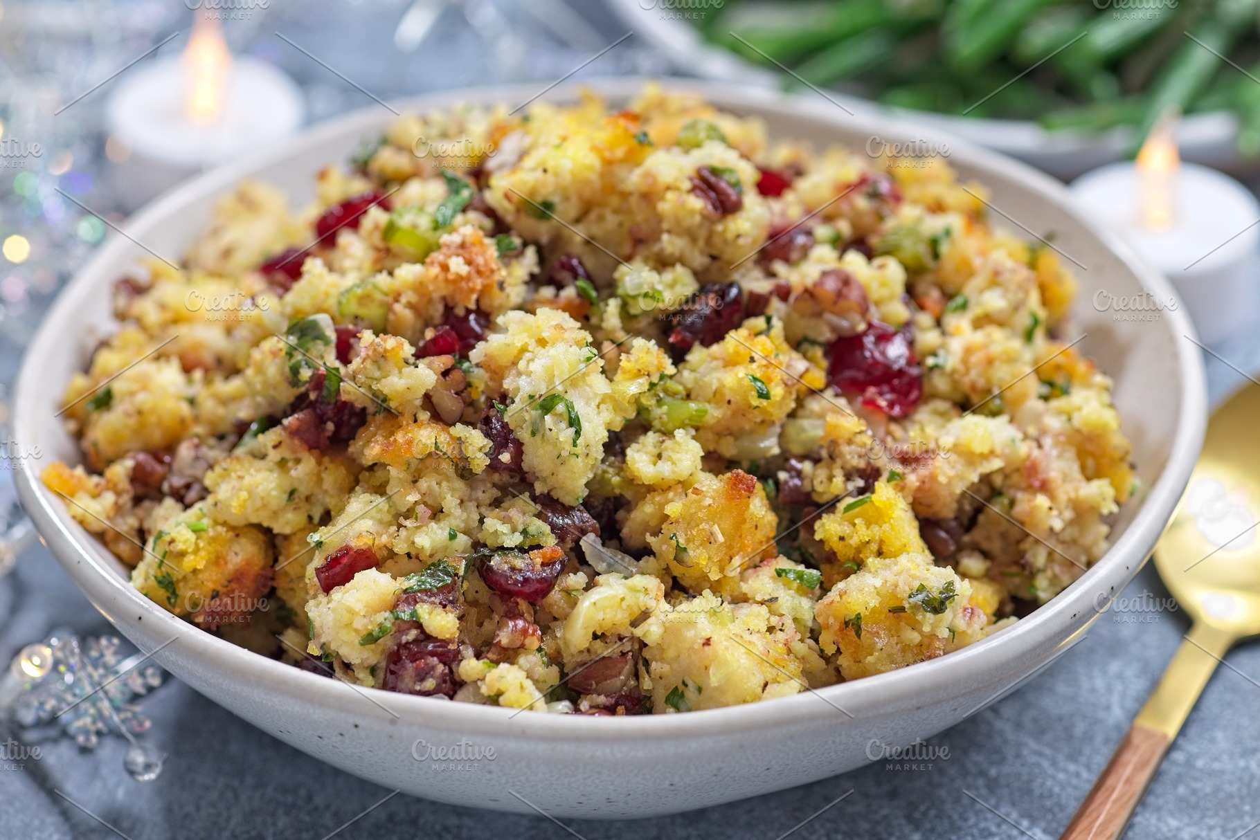 Cranberry pecan cornbread dressing for poultry or meat stuffing, in bowl, horiz, a Food & Drink Photo by iuliia_n
