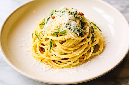 Pasta with greens and parmesan cheese on marble table, homemade, a Food & Drink Photo by Anneleven