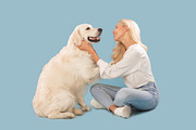 Loving caucasian woman carrying her sweet fluffy golden retriever dog, owner ha, a Photo by Prostock-Studio (Thumbnail 2 of 2)