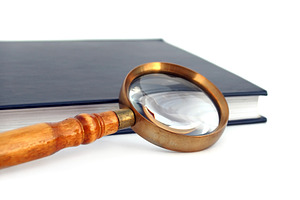 Old style magnifying glass isolated, a Photo by saiko3p
