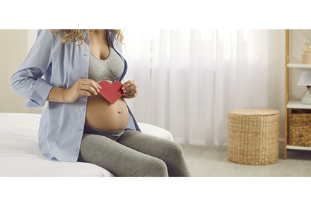 Loving expectant mother sitting on, a Person Photo by StudioRomantic