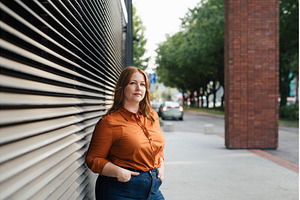 Plus size woman standing outdoors in, a Person Photo by HalfPoint