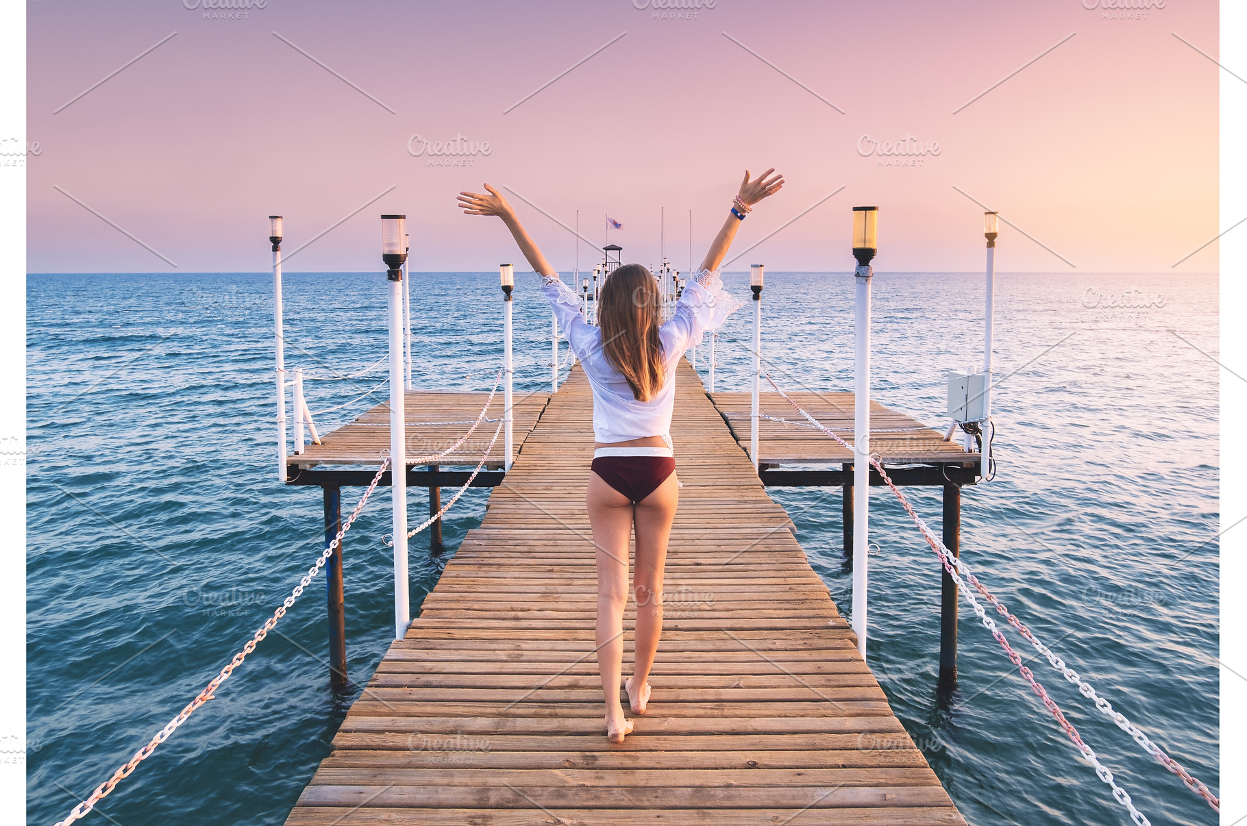 Happy woman in bikini with raised up, a Person Photo by den-belitsky