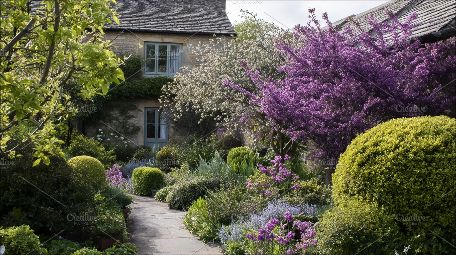 Quaint English cottage surrounded by a vibrant spring garden fea, a Photo by Studio ANNA