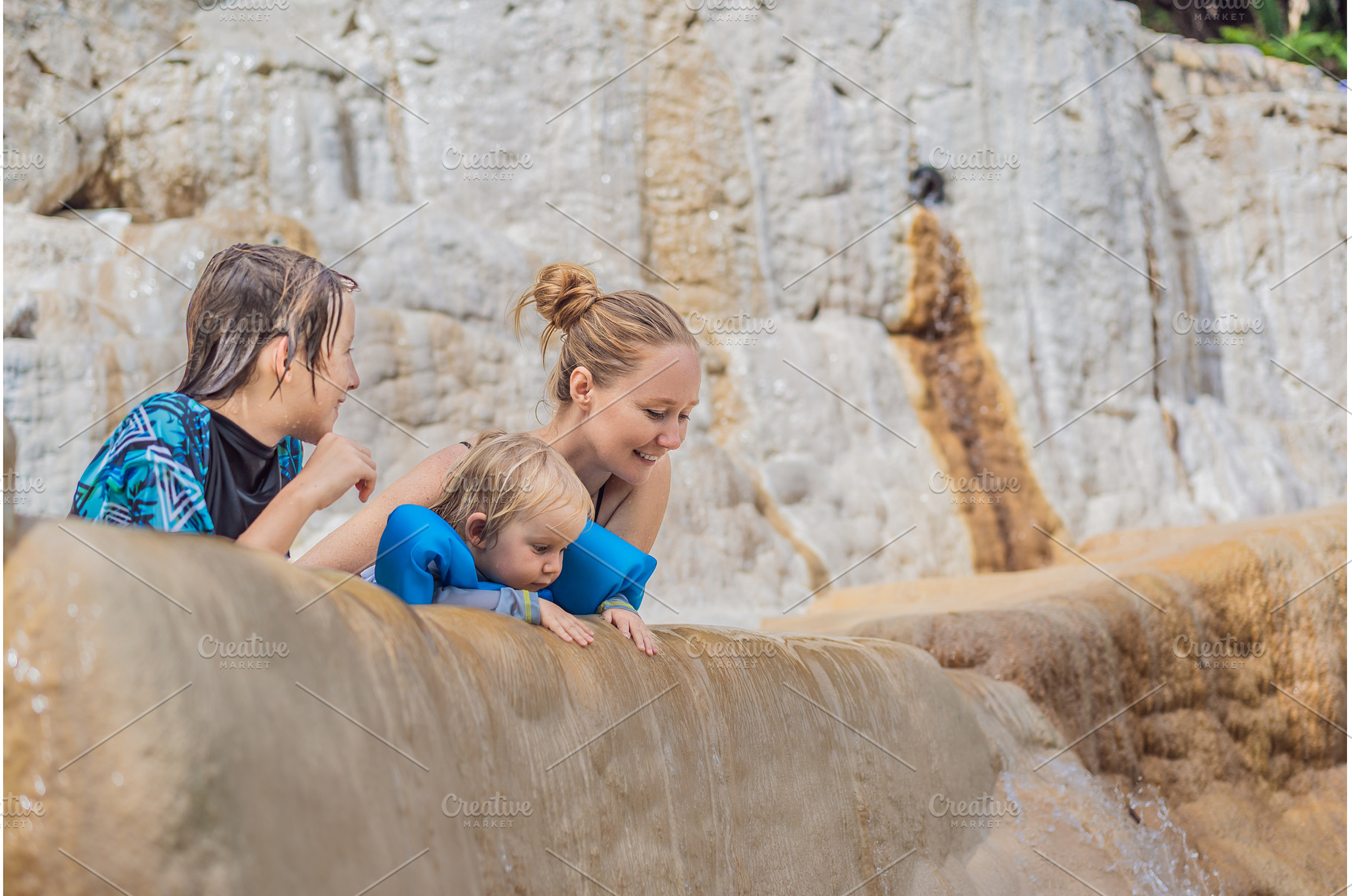 Mother with her toddler and teenage, a Holiday Photo by Elizaveta Galitskaya