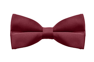 Classic burgundy bow tie on white background, perfect for formal, a Holiday Photo by Ales Munt