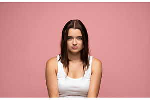 Young woman with serious expression, a Person Photo by volodymyrshtun13795