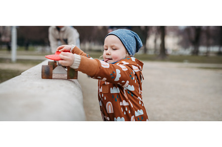 Cute toddler girl playing outdoor in, a Nature Photo by HalfPoint