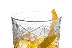 Rusty Nail Cocktail with Lemon Peel in Crystal Glass, a Photo by etorres69