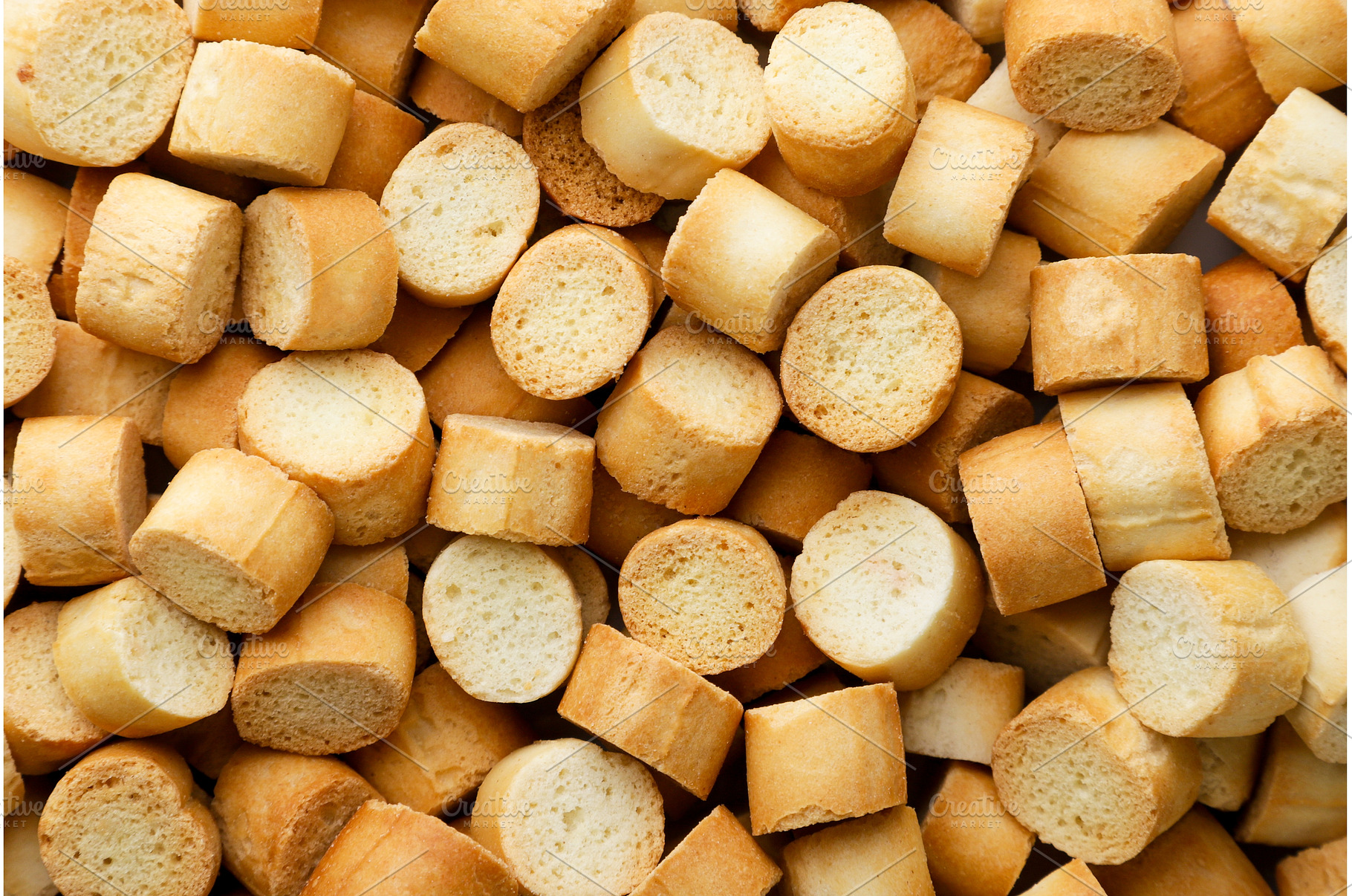 Crispy croutons background. Top view, a Food & Drink Photo by innakreativ