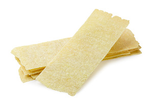 Long potato chips on a white, a Food & Drink Photo by innakreativ