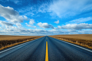 Road stretching towards the horizon, a Photo by Pavel_design