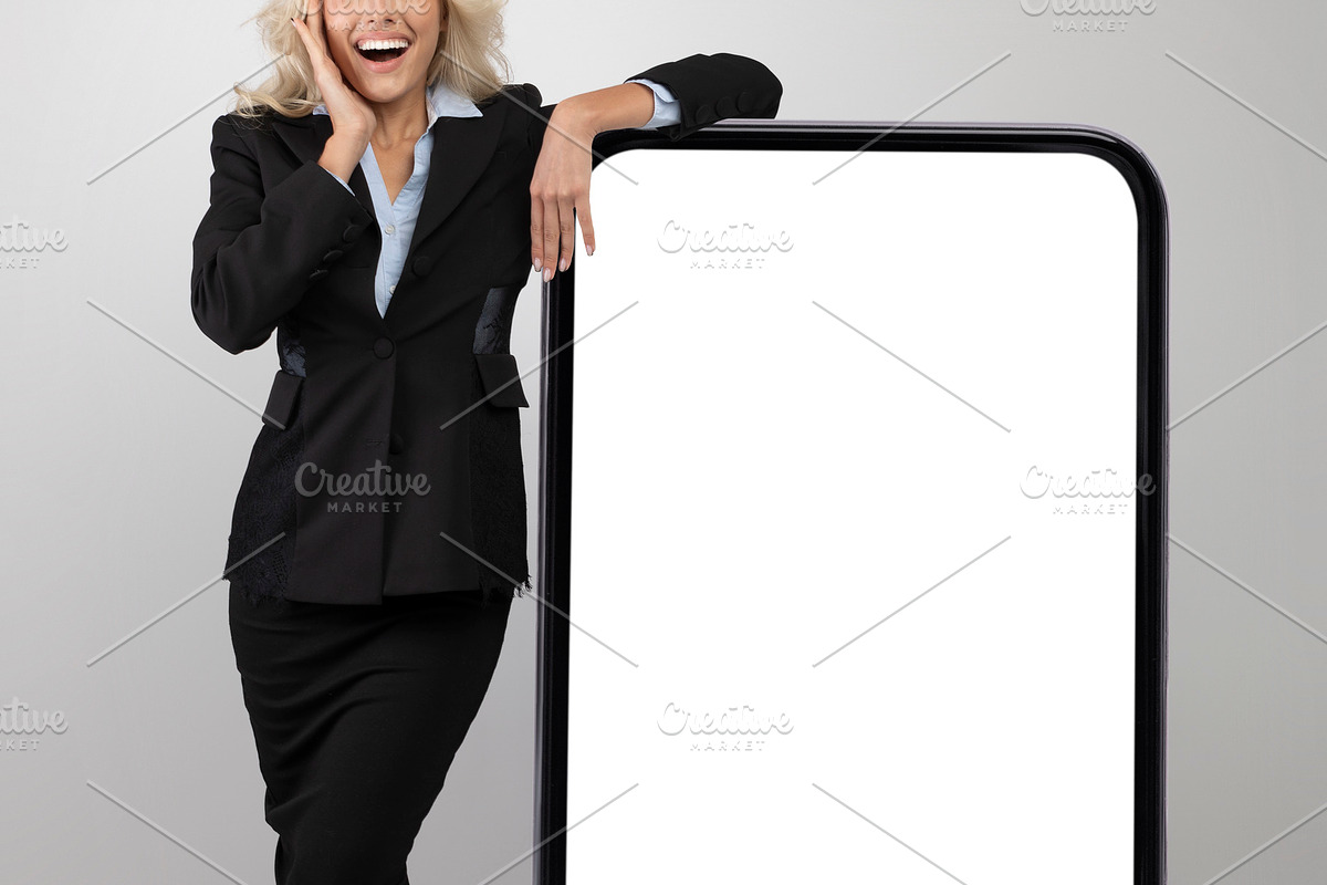 Business app. Excited female entrepreneur in formal wear leaning at big blank s, a Photo by Prostock-Studio (Photo 1 of 2)
