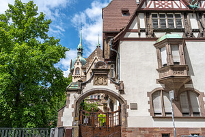 Historic building with ornate gate in Strasbourg, an Architecture Photo by GoodGoods