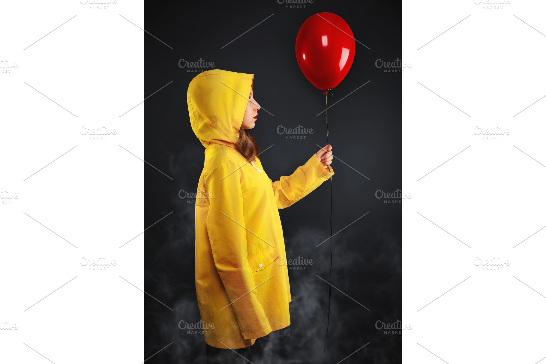 Sad little girl in haze yellow coat., a Background Photo by LoopAll