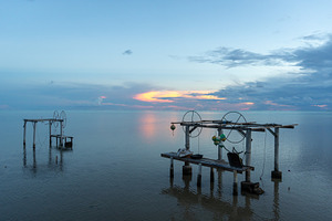 Sunrise over the peaceful lagoon of Maupiti, French Polynesia, a Nature Photo by GoodGoods