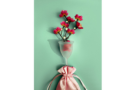 Menstrual cup with red flowers and, a Health & Medical Photo by tilialucida