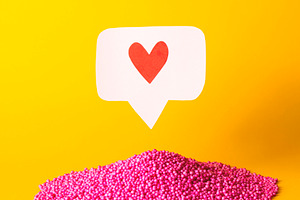 Social media heart icon featuring emoji, innovate, and electronic
