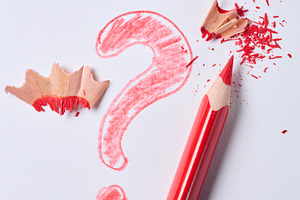 Red pencil and a drawn question mark with shavings on a white ba, a Background Photo by ndanko