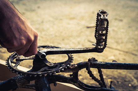 Mechanic hands repairing a bike