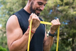 Man doing bicep curl with resistance band, a Sports & Recreation Photo by etorres69