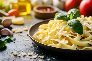 Fettuccine pasta with truffle and fresh basil, beautifully plated in a rustic s, a Food & Drink Photo by AlyaAnd