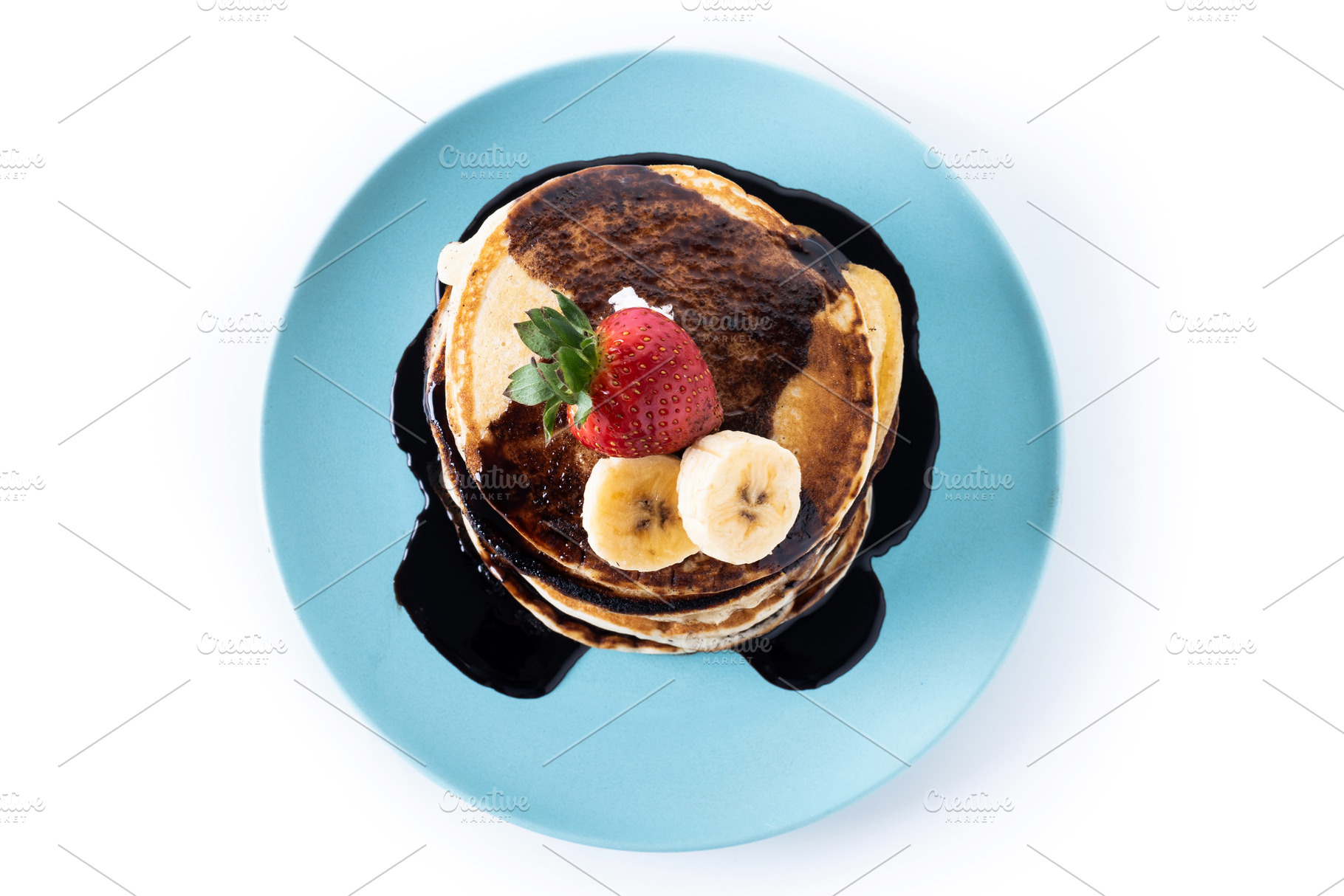 Pancakes with chocolate and fruit isolated on white background, a Food & Drink Photo by etorres69