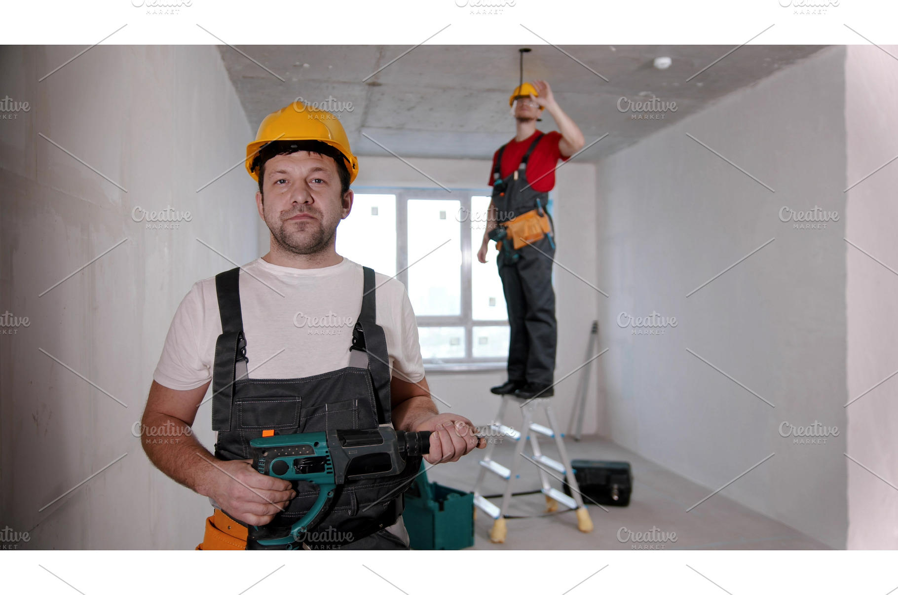 A man worker standing in front of, a Person Photo by Barcelona_dreams