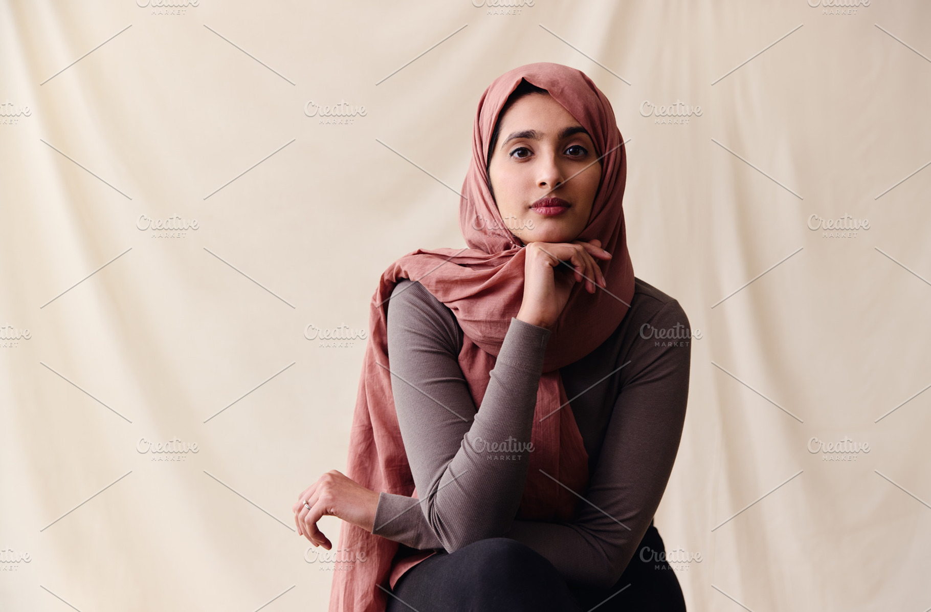 Portrait of confident young Middle Eastern woman wearing hajib looking at camer, a Technology Photo by Southworks