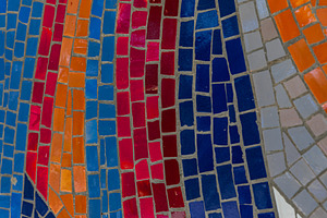 Close-up view of vibrant mosaic tiles in red, orange, blue, and, a Background Photo by Ales Munt