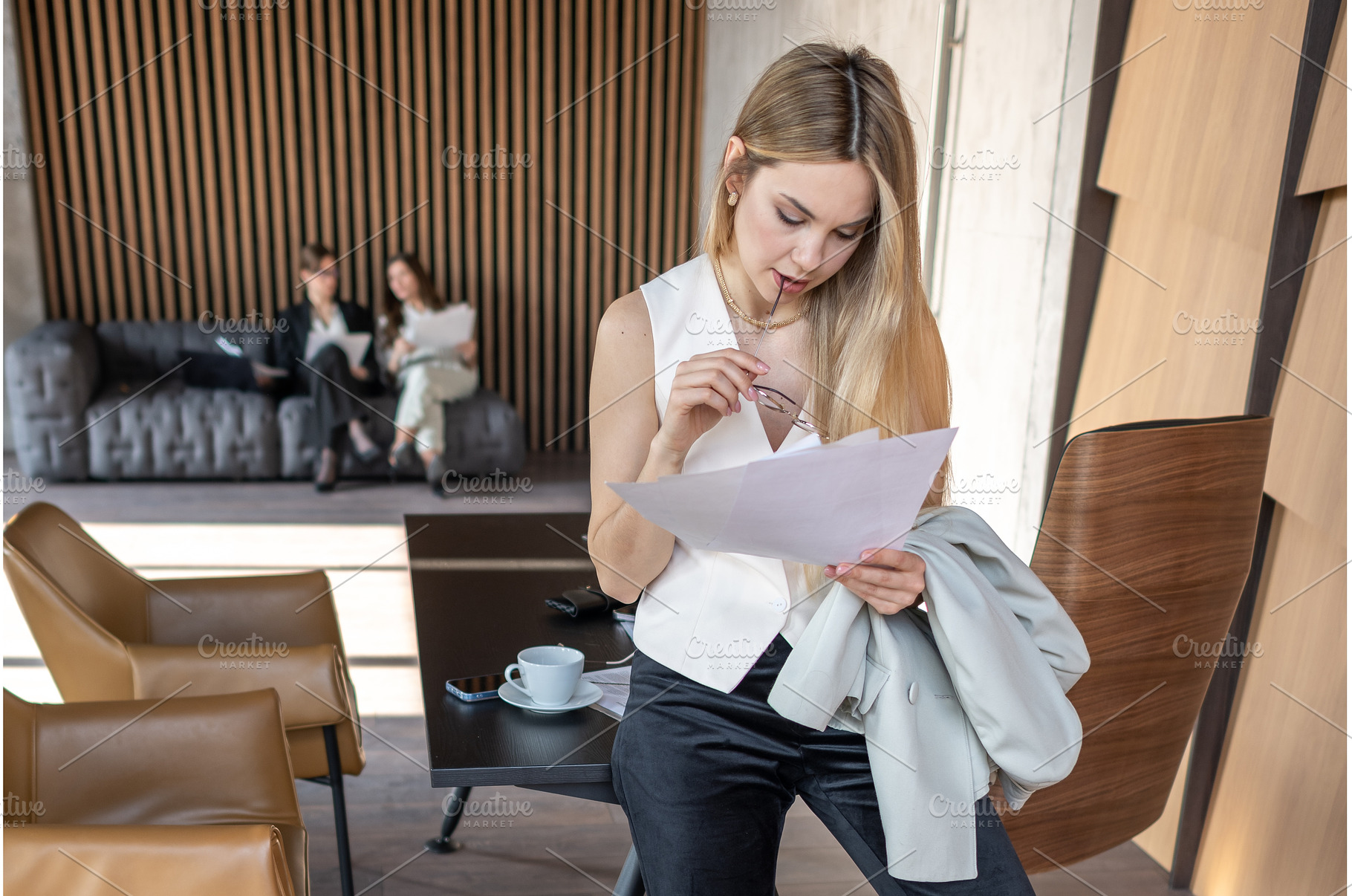 Businesswoman reading documents, a Business Photo by undrey
